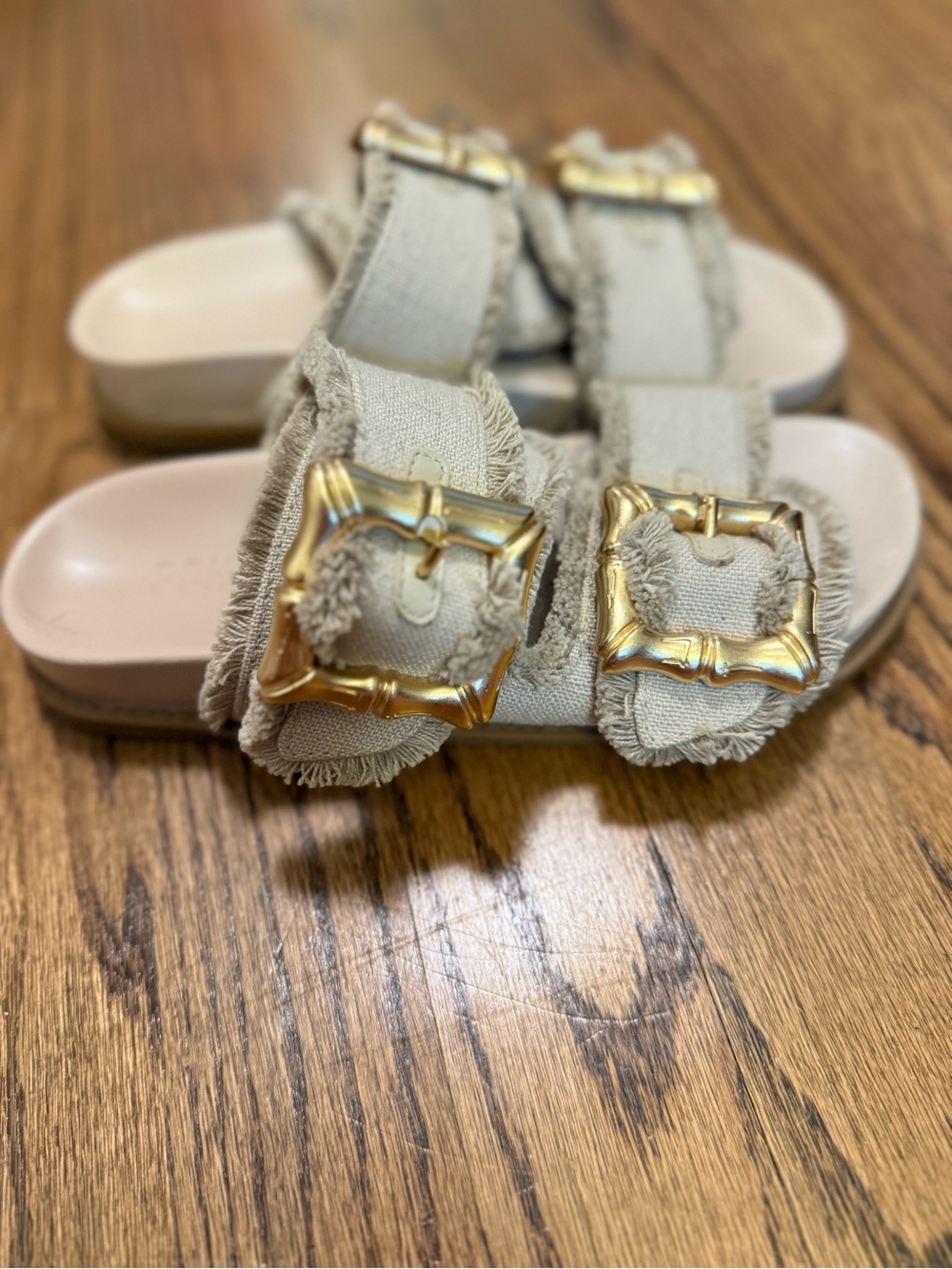 SCHUTZ Cream Frayed Double-Buckle Slide Sandals with Gold Buckles